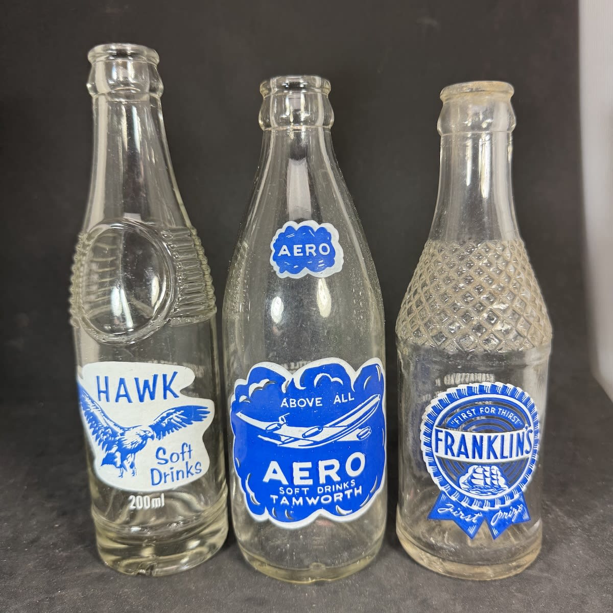 3 Blue & White Ceramic Label Crown Seals: Hawk Soft Drinks, Eaglehawk; Aero Soft Drinks Tamworth; Franklins, J. T. Franklin & Co Pty Ltd, Geelong. (Victoria & New South Wales)