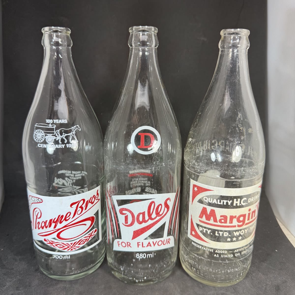 3 Red & White large Ceramic Label Crown Seals: Sharpe Bros Sydney 100 years 1968; Dales Beverages Pty Ltd; Margin's Pty Ltd Woy Woy. (New South Wales)