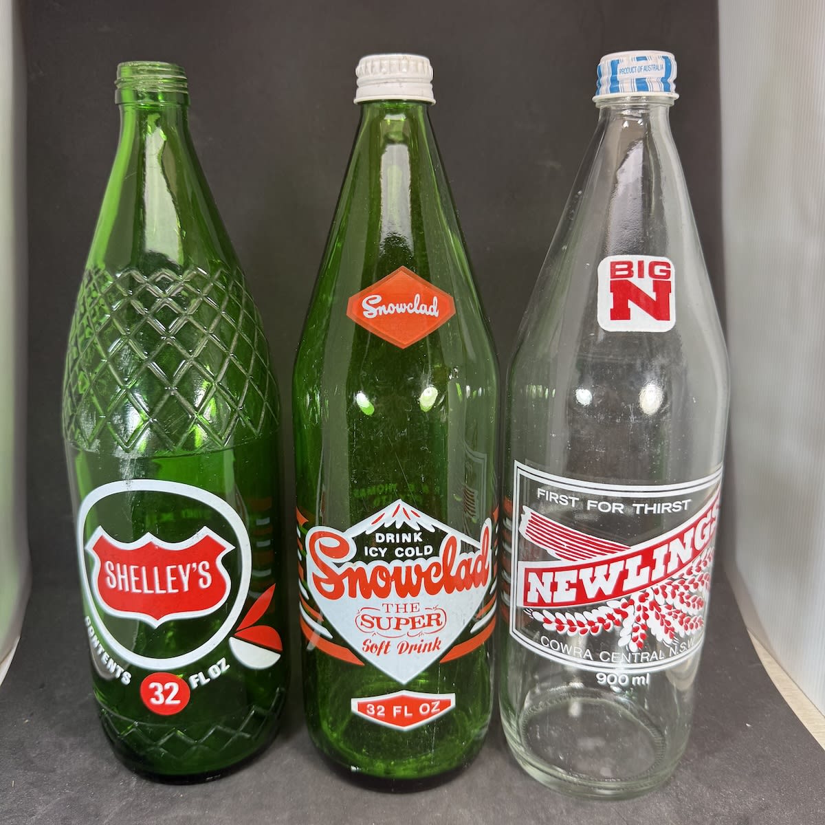 3 x 32 oz/900 ml screw top ceramic label soft drinks: Shelley's, Sydney; Snowclad, F. & E. Thomas Inverell; Newlings Cowra. (New South Wales)
