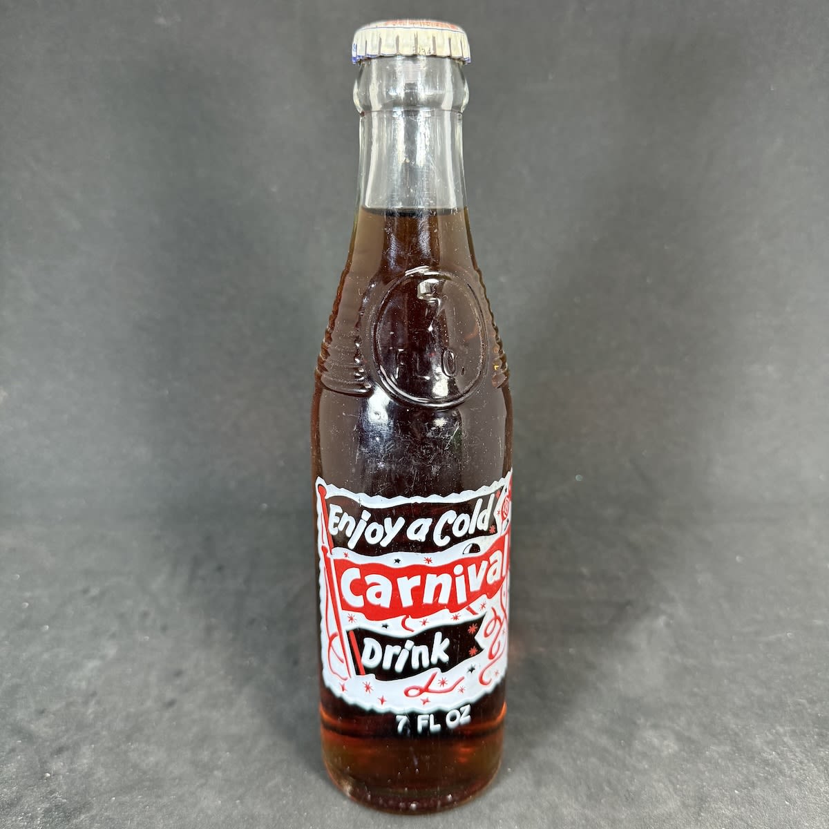 Ceramic Label Crown Seal. Carnival Drink. 7 oz Bullet type. Goode Cordials Sarina. Carnival cap but the bottler printed is Glovers Soft Drinks Bendigo. (Queensland & Victoria)