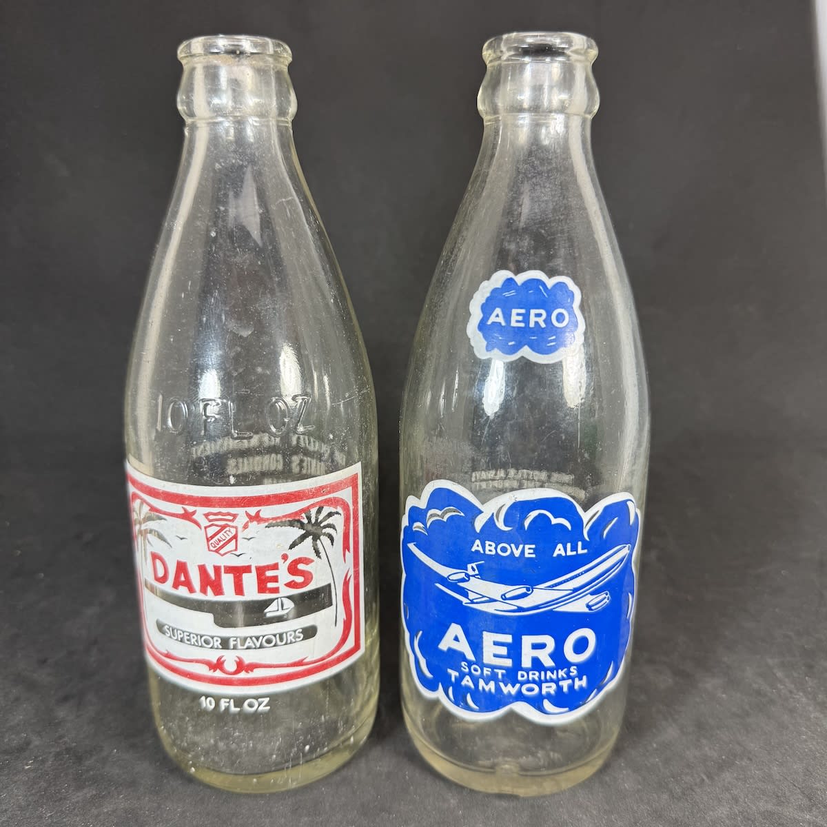 2 Ceramic Label Crown Seals: Dante's Cordials, Ingham; Aero Soft Drinks, Tamworth. 10 oz. Red & White and Blue & White prints. (Queensland & New South Wales)