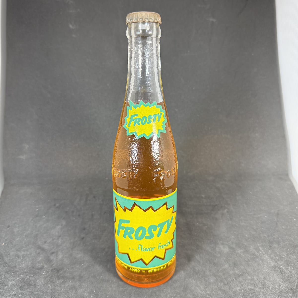 Ceramic Label Crown Seal. Frosty, Consolidated Beverage Co Ltd Sydney. Still sealed with contents and Frosty Orange Flavor cap. (New South Wales)