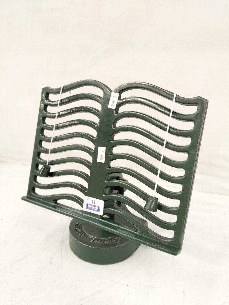 CAST IRON BOOK STAND — NZ auction result