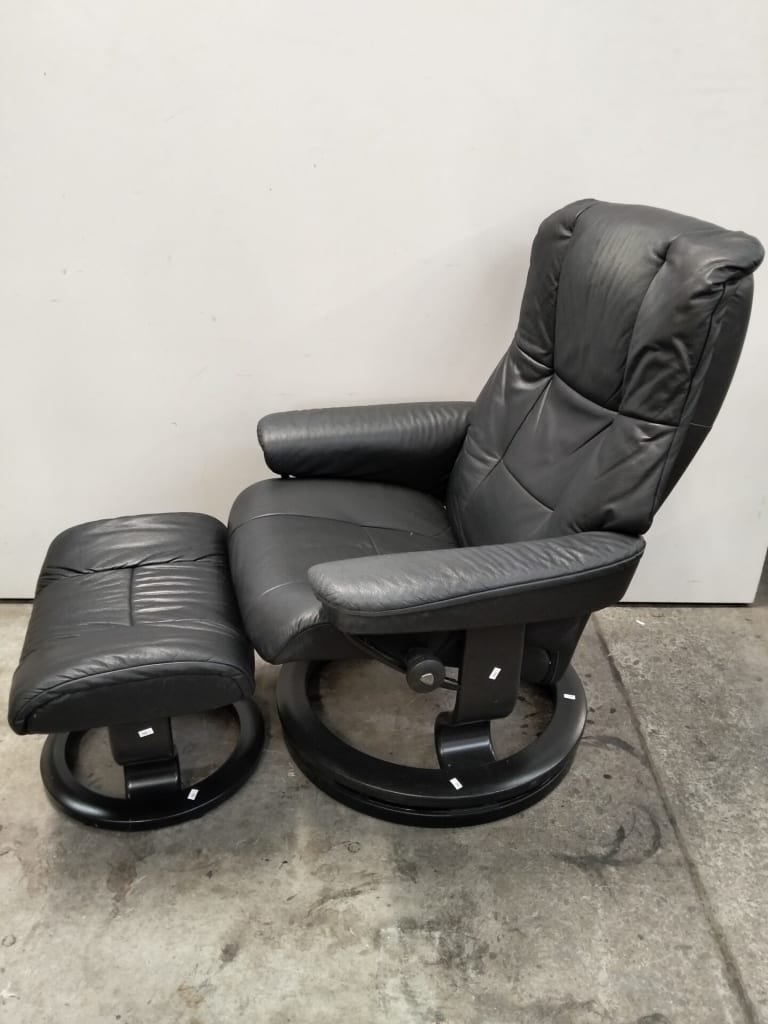STRESSLESS LEATHER RECLINER AND STOOL — NZ auction result