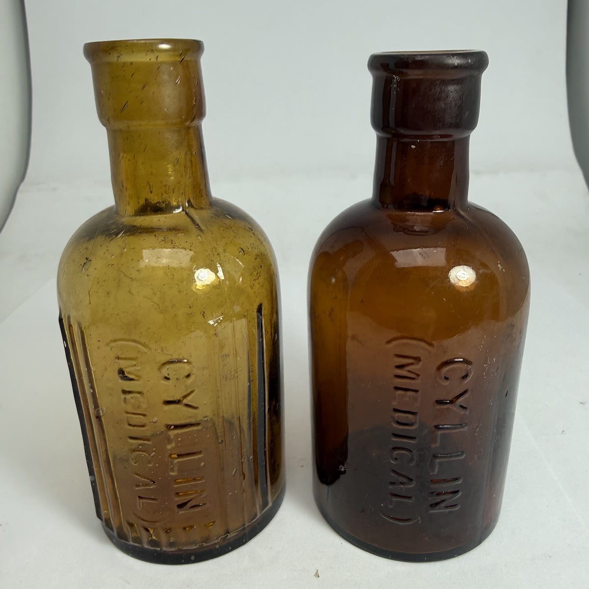 2 Poisons. Both Cyllin (Medical). One with ribs and one without. 2 oz. 115 - 117 mm