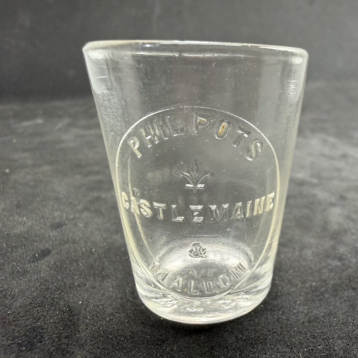 Dose Cup. Philpots Castlemaine & Maldon. Fleur De Lis. Medicine Glass. One Tablespoon. (Victoria)