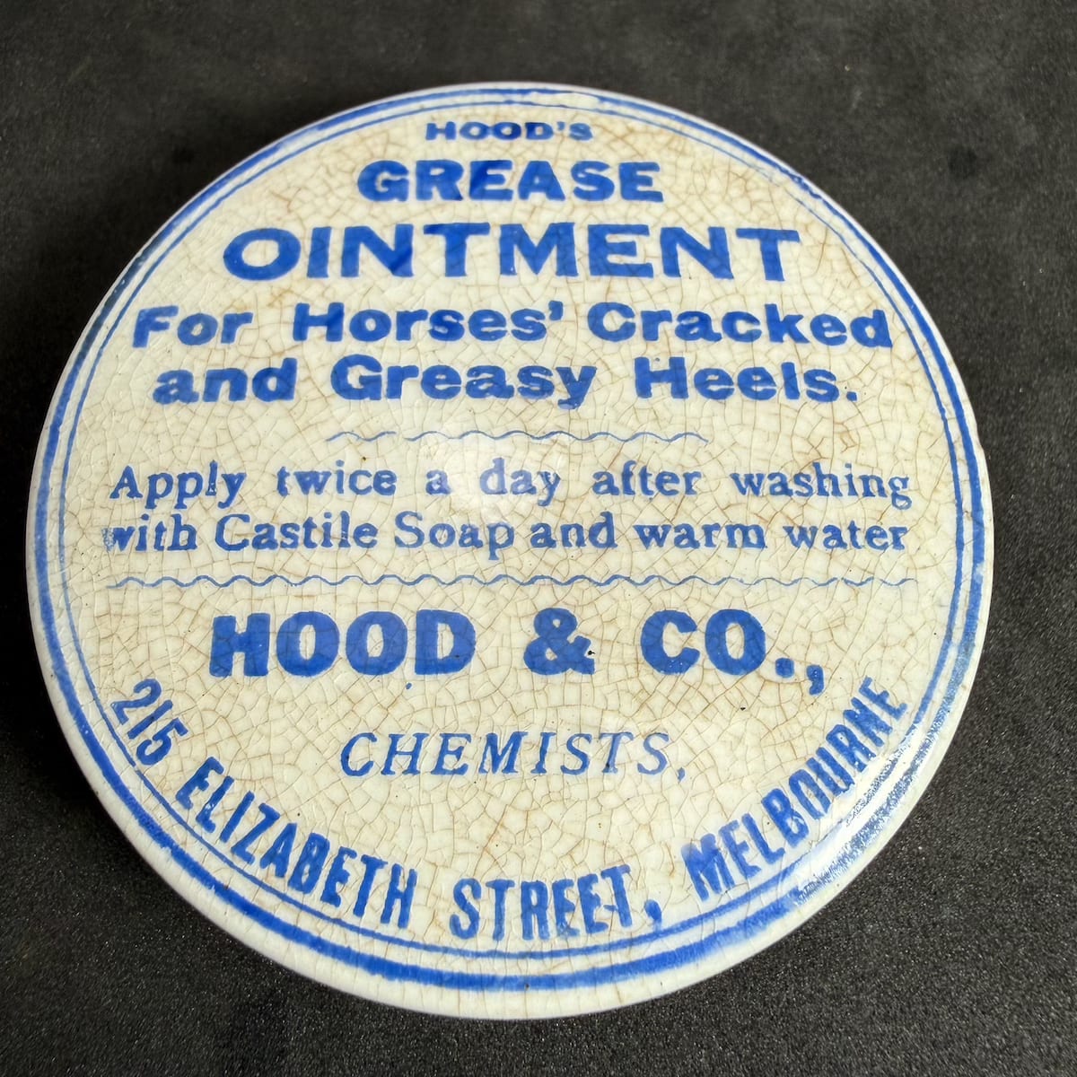 Pot Lid. Hood's Grease Ointment. Hood & Co., Chemists, 215 Elizabeth Street, Melbourne. Blue Print. 76 mm diameter. (Victoria)