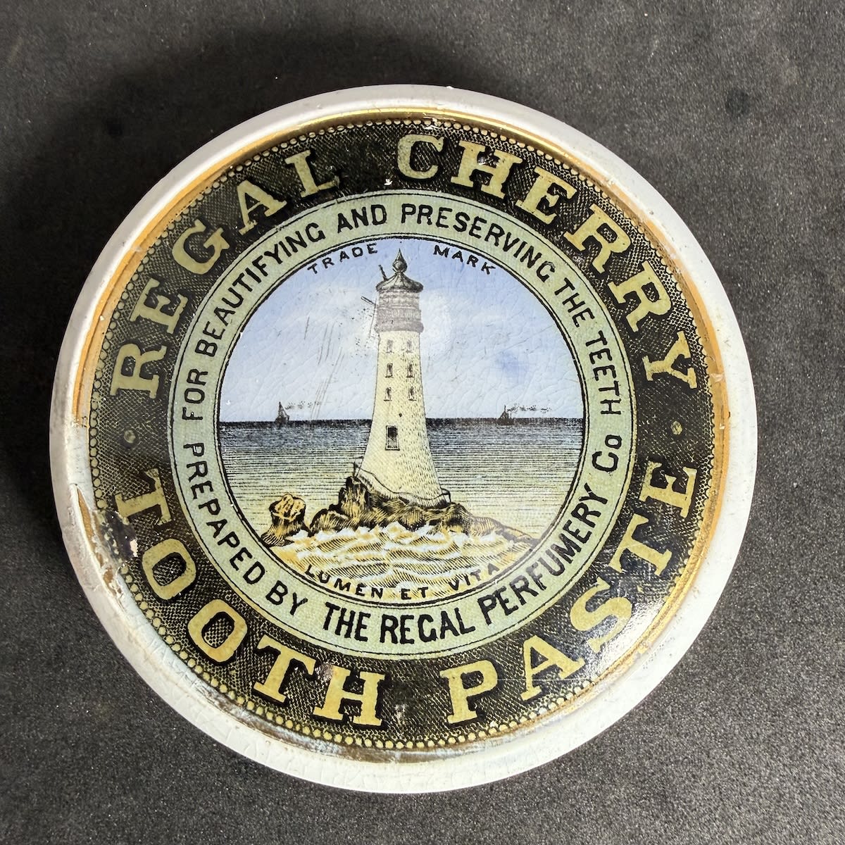 Pot Lid. Regal Cherry Tooth Paste. Regal Perfumery Co. Lighthouse. (R. F. Kennedy, Warrnambool) (Victoria)