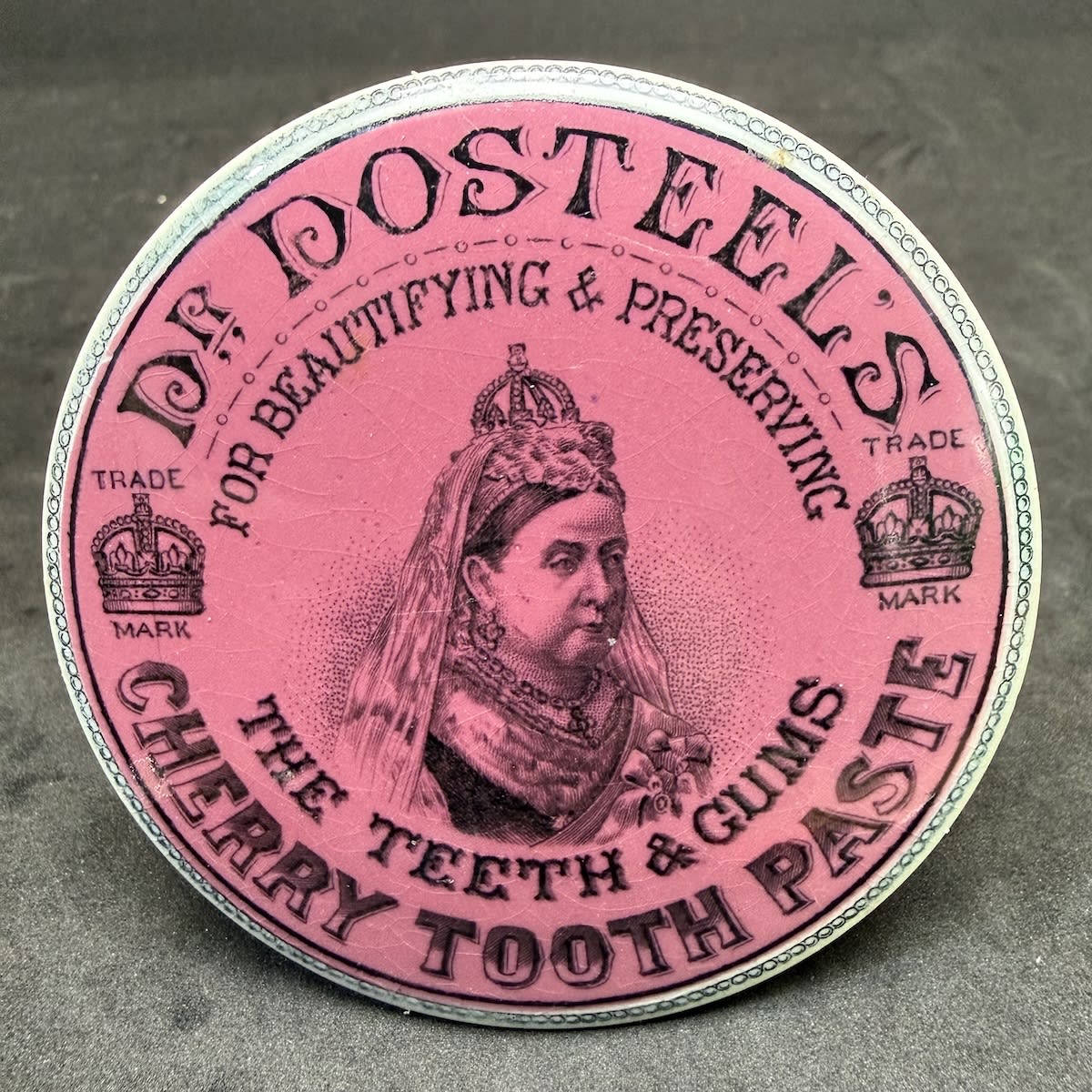 Pot Lid. Dr Dosteel's Cherry Tooth Paste. Crown. Jubilee Head portrait of Queen Victoria. Black on Pink.