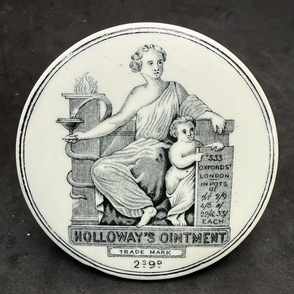 Pot Lid. Holloway's Ointment, 533 Oxford St., London. 2s 9d. (United Kingdom)