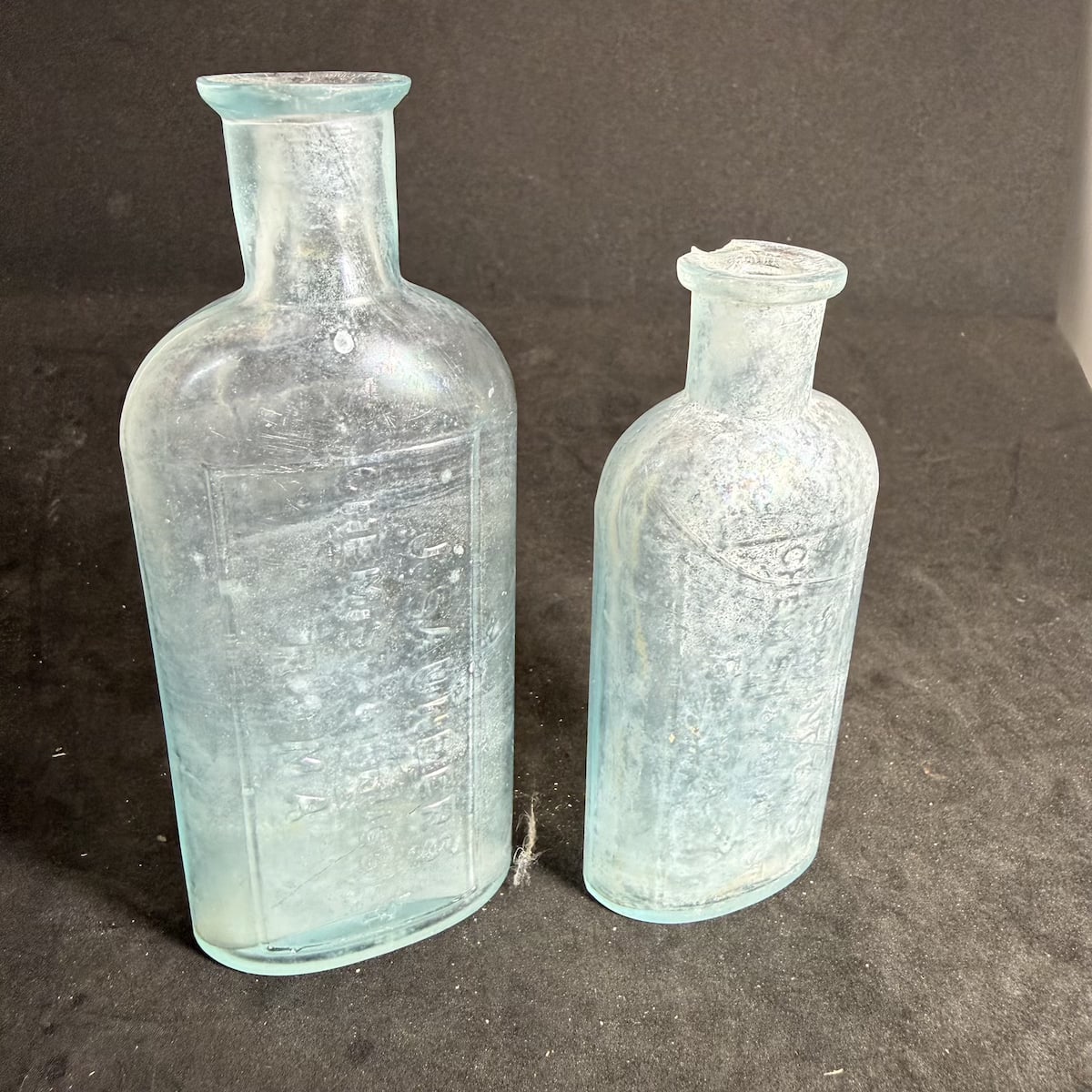 2 Chemists: J. Saunders, Chemist & Druggist, Roma. Oval shapes. 2 & 3 oz. 104 & 127 mm. (Queensland)