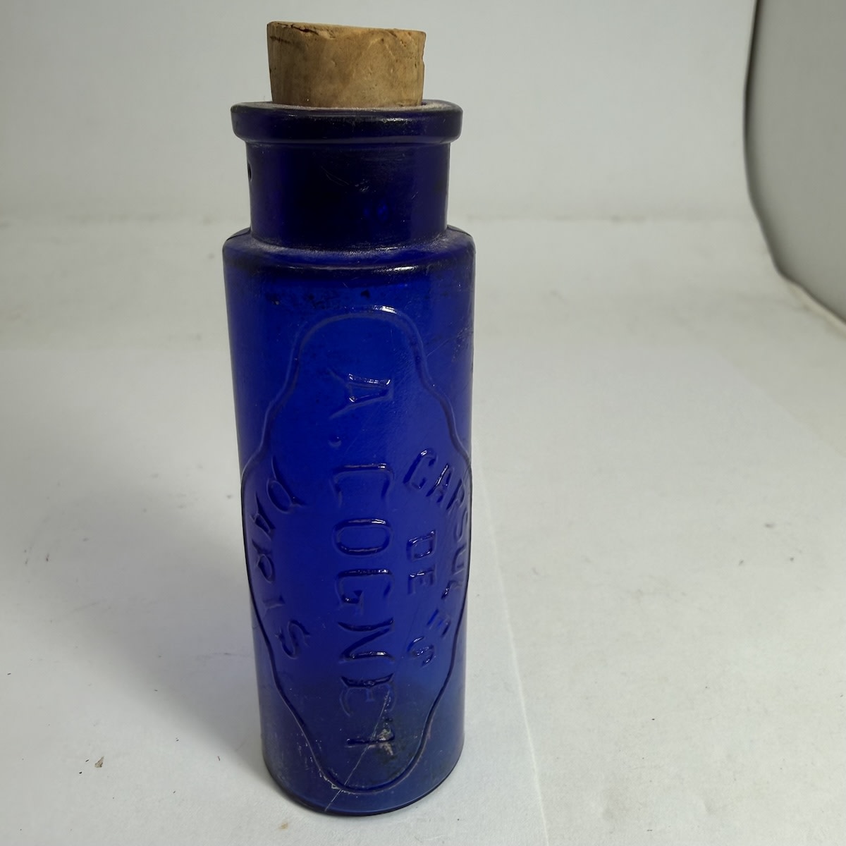 Cure. Capsules de A. Cognet, Paris. Small cobalt blue bottle. 99 mm without cork. (late Kingsley Durdin Collection)