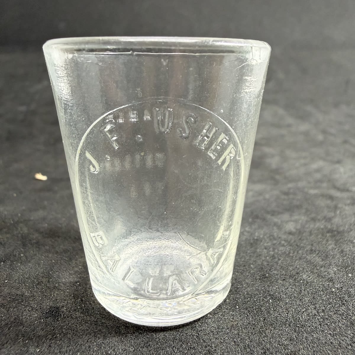 Dose Cup. J. F. Usher, Ballarat. Whitall Tatum made. 1 Tablespoon size. (Victoria)