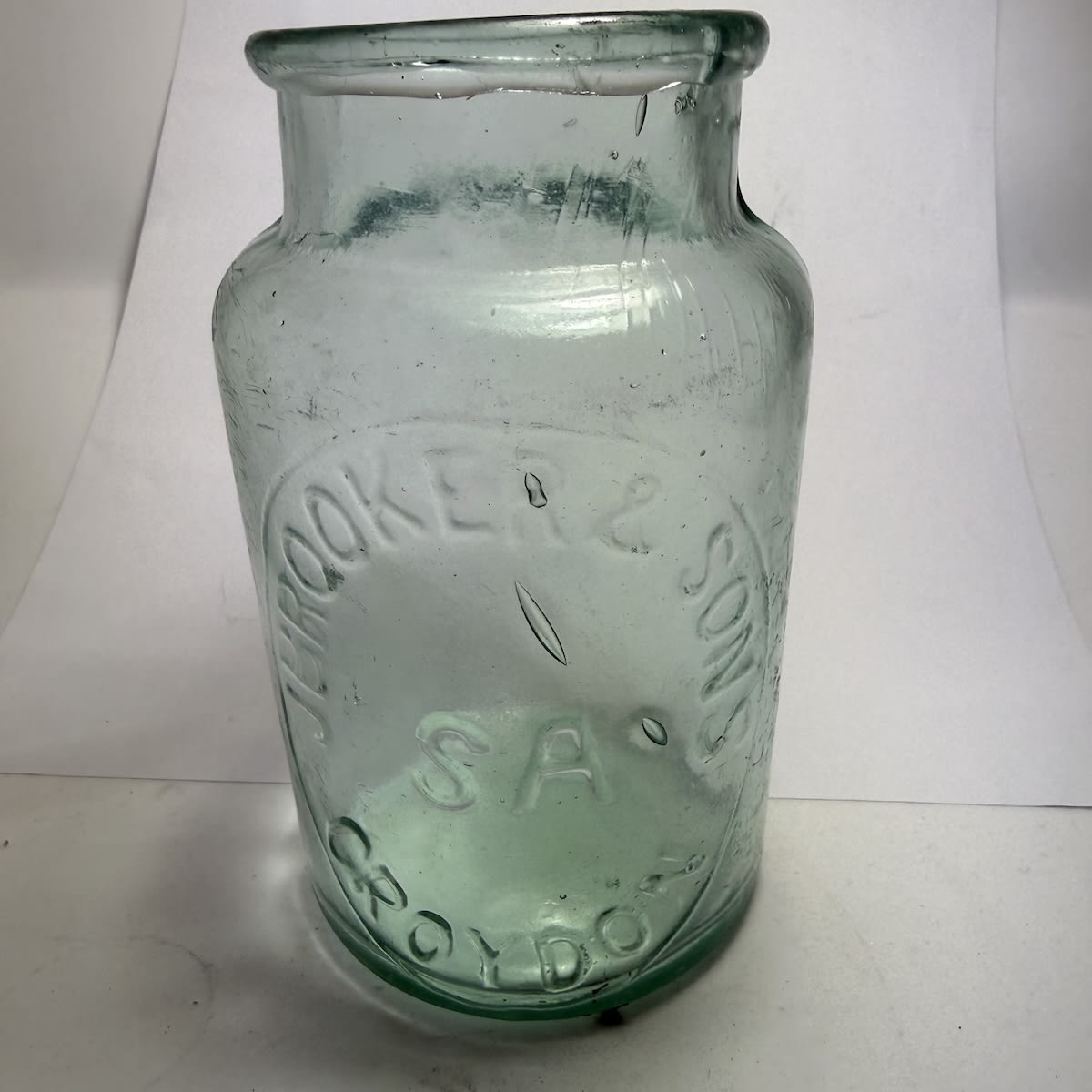 Jar. J. Brooker & Sons, Croydon, SA. Half Pint. Rolled lip. Big print and name is embossed JBrooker as one continuous word. (South Australia)