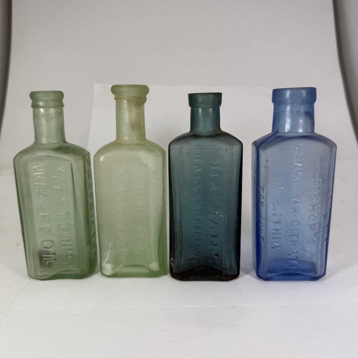 4 Medicines/Cures: Westons Wizard Oil, Frank Weston; Moulton's Pain Paint; Hayman's Balsam of Horehound; Bishop's Granular Citrate of Lithia.