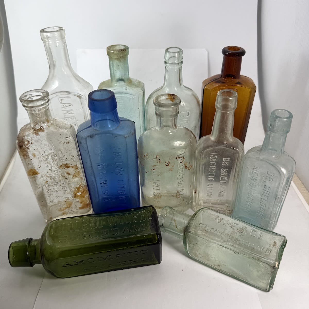 11 Small Bottles: Lanes Emulsion; Wolfes Schnapps; Dr Sheldons; Soul Pattinson Sydney; Clements Tonic; Woods; Dinnefords; etc.