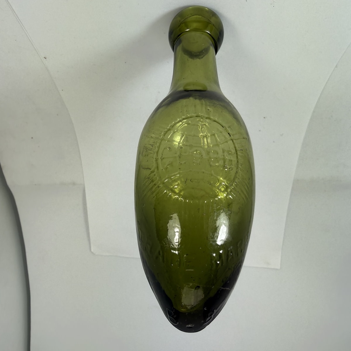 Torpedo. Leigh & Co., Salford. Globe trade mark. Green. 6 oz. (UK)