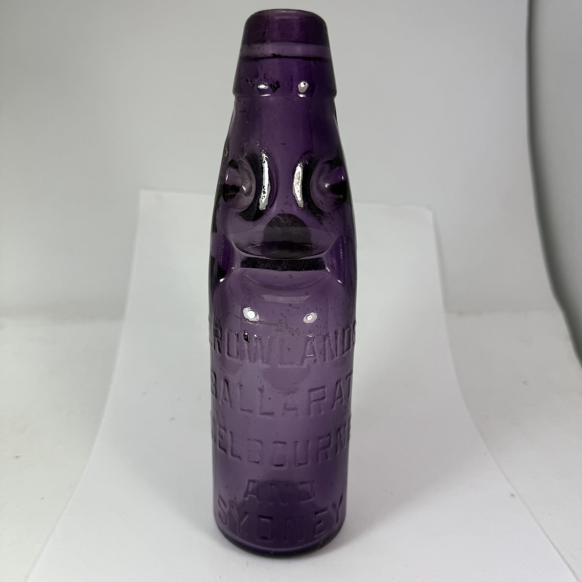 Codd. E. Rowlands, Ballarat, Melbourne and Sydney. Triangle base mark. Dark Sun Coloured Amethyst. 6 oz. (Victoria & New South Wales)