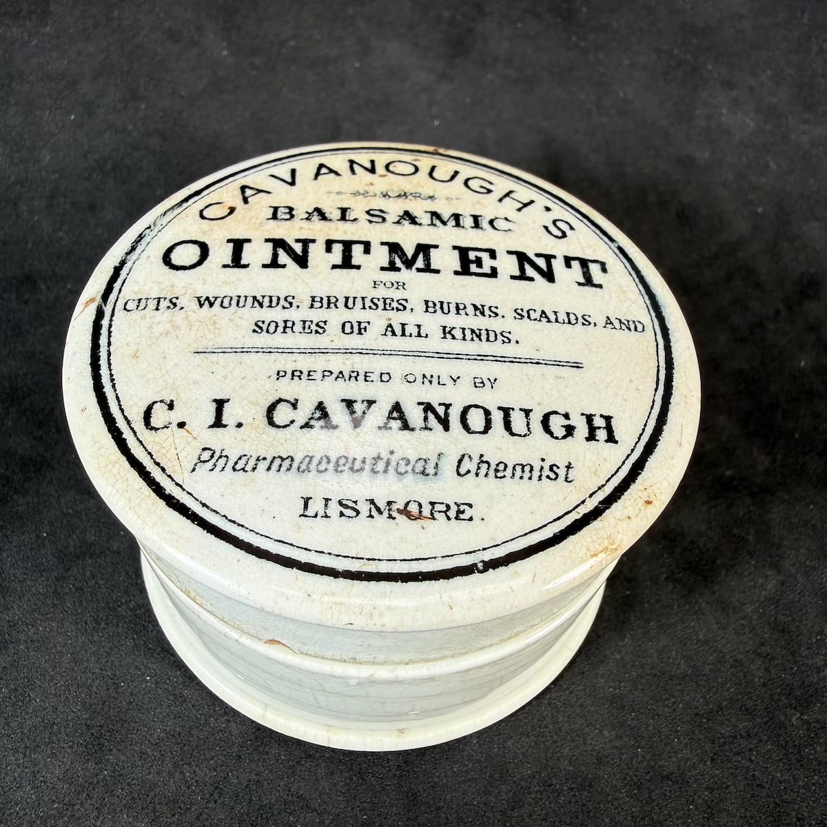 Pot Lid. Cavanough's Balsamic Ointment. C. I. Cavanough, Lismore. Black & White. With a base. (New South Wales)
