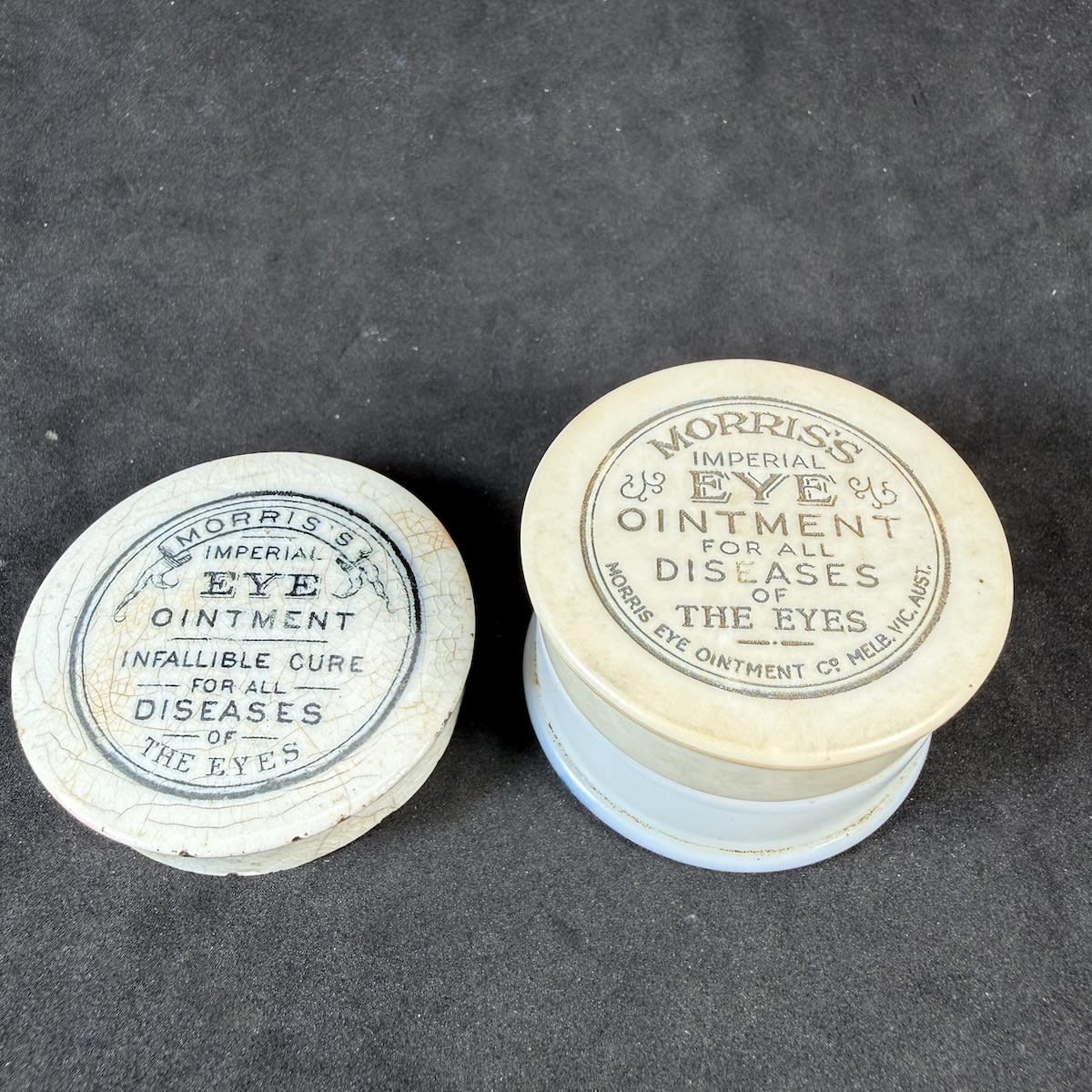 2 Pot Lids. Both Morris's Imperial Eye Ointment. Earlier ceramic one with ribbon print. Later hard plastic type on its original milk glass base. Morris Eye Ointment Co., Melbourne. (Victoria)