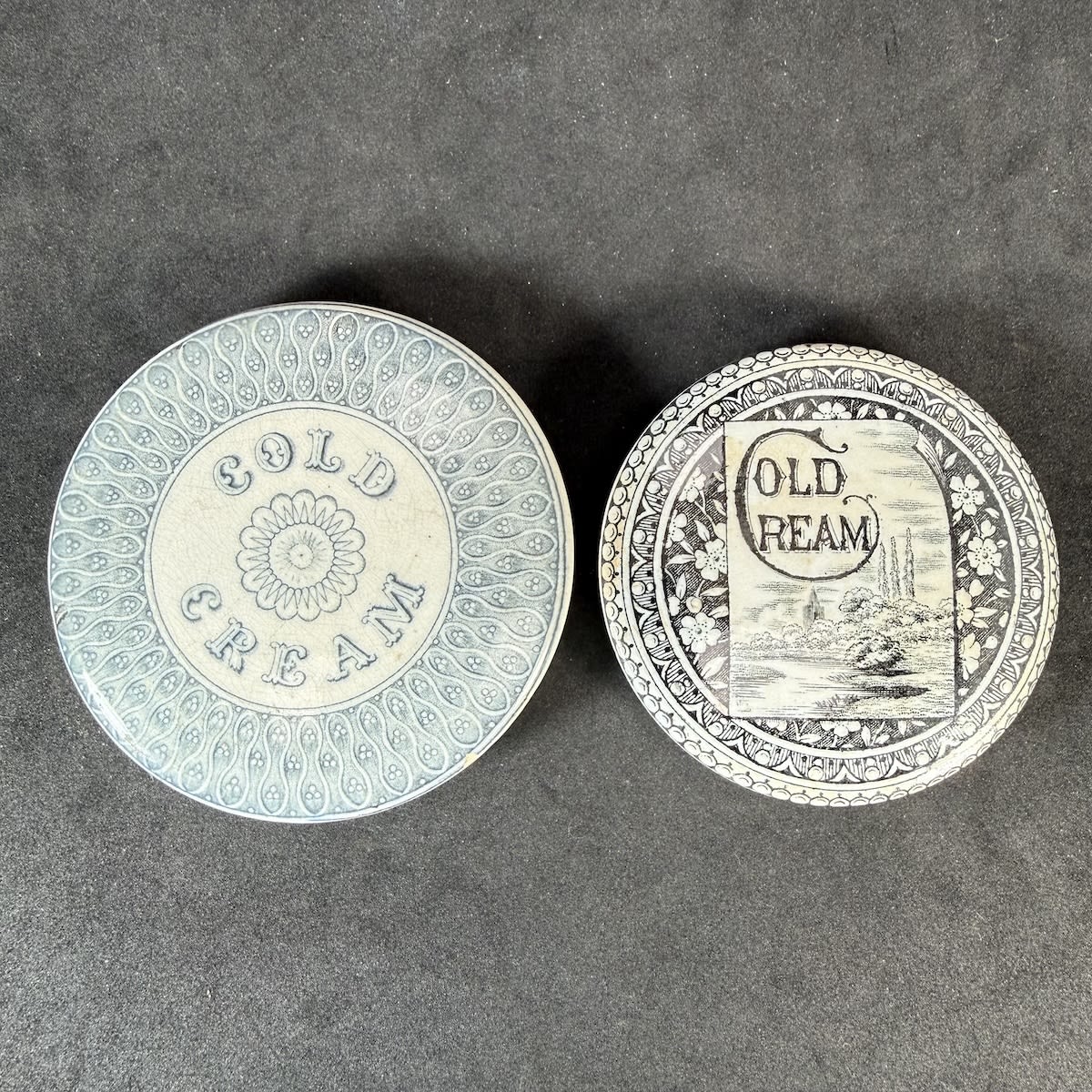 2 Cold Cream Pot Lids. Larger early looking one with kind of floral pattern; Smaller one with stream, house and poplar trees.