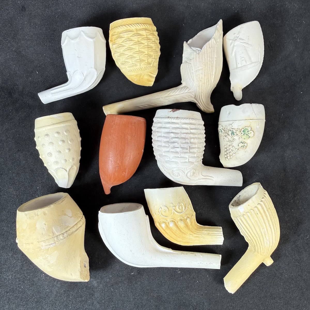 12 Clay Pipe Bowls: Bunch of Grapes; Person on Horseback/Windmill; Basket Weave; Fancy Patterns etc.