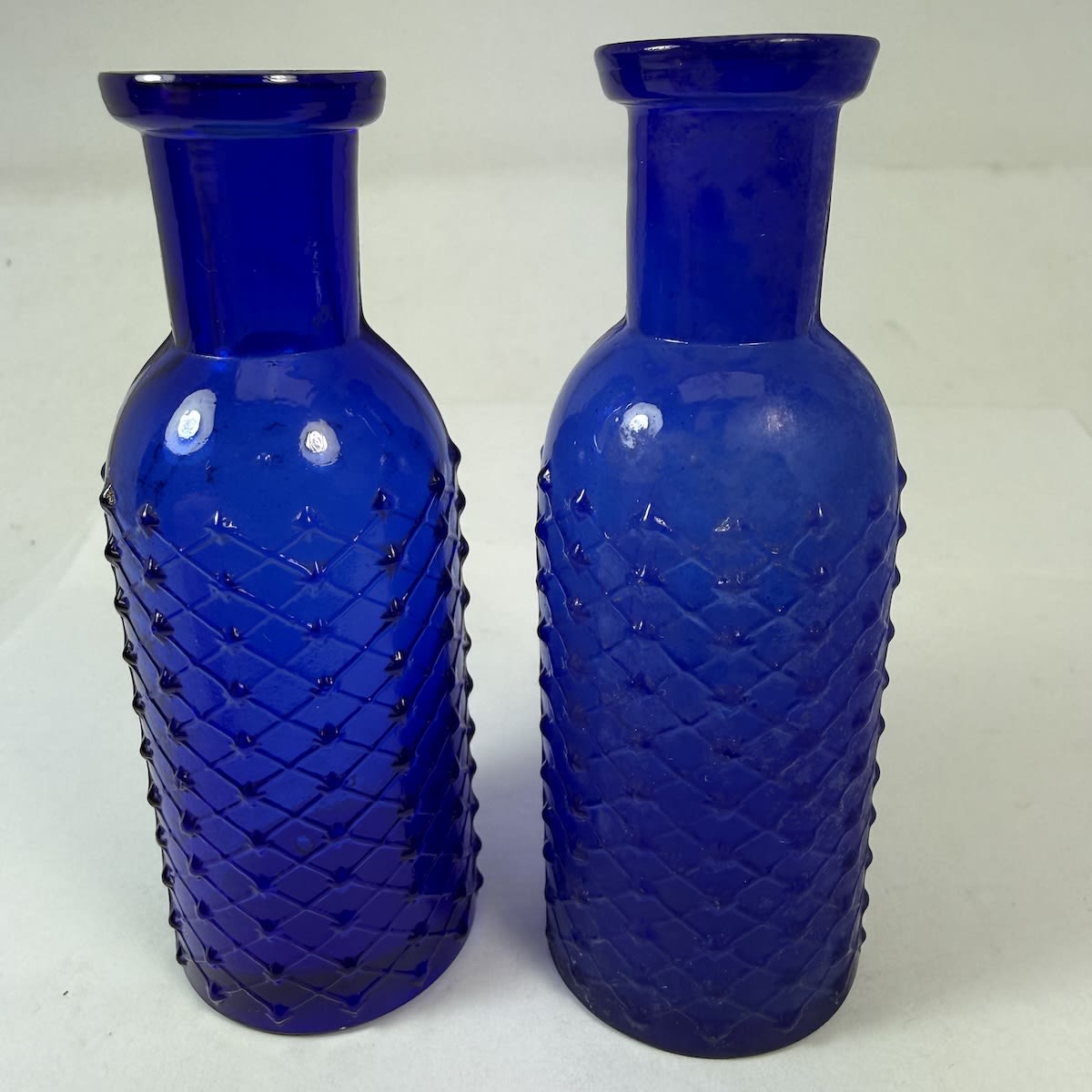 2 Poisons. Both Whitall Tatum & Co. Round with diamond points and label space. W. T. & Co. / 2 on both bases. 85-86 mm.