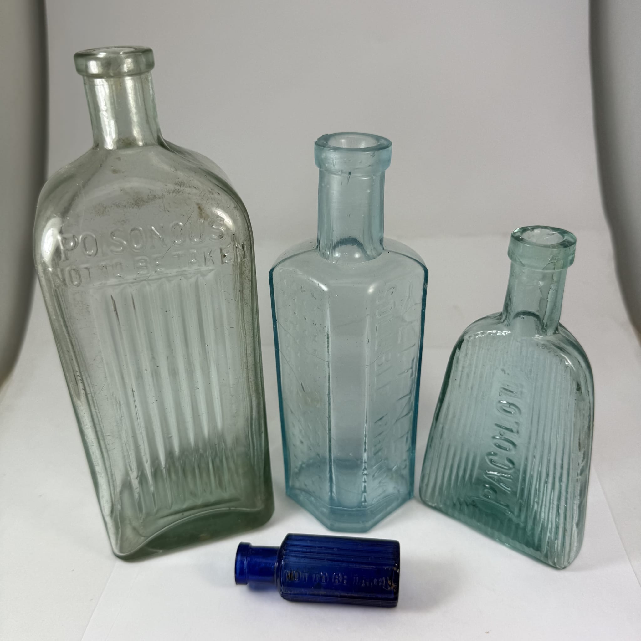 4 Poisons: Poisonous, Not to be Taken Ammonia type; Littles Soluble Phenyle; Pacolol; Not To Be Taken, Made in Japan tiny hexagonal.