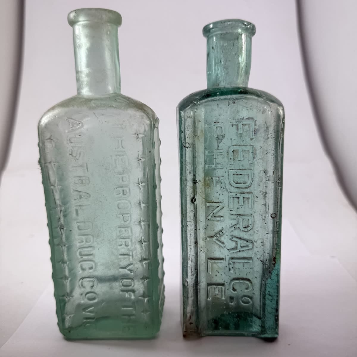 2 Poisons/Phenyles: Austral Drug Co; Federal Co. Fancy shape and/or crosses etc. (Victoria)