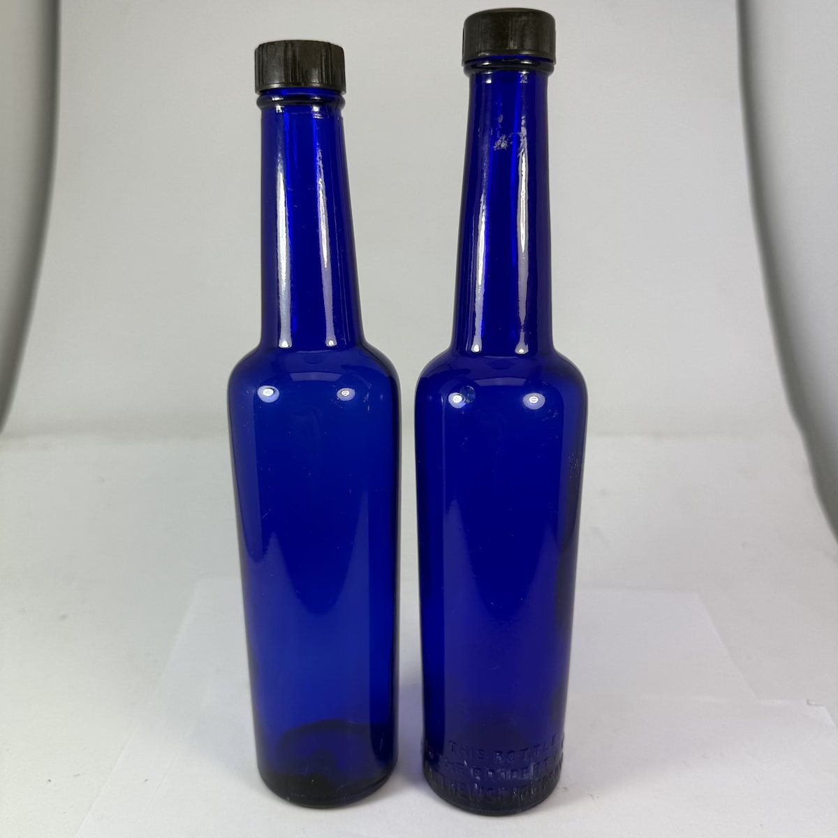 2 Screw top Castor Oils. Original Caps. One is plain, other is Matthews Thompson & Co Ltd Sydney & Newcastle embossed around base.