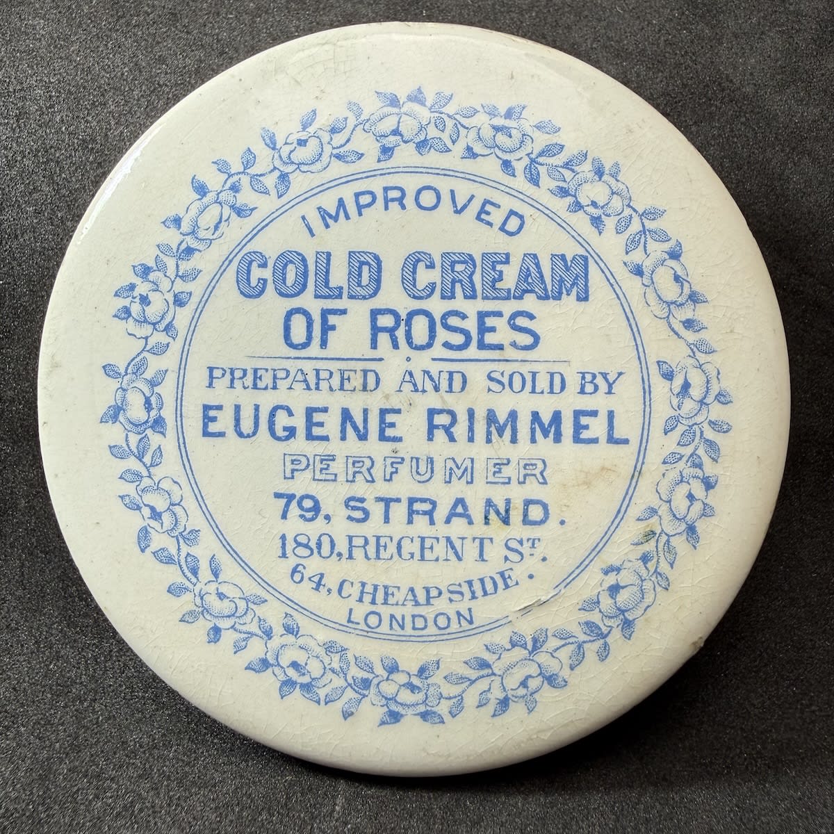 Pot Lid. Eugene Rimmel, Cold Cream of Roses. 79 Strand, 180 Regent, 24 Cheapside. London. Blue on White. 72 mm diameter. (Different addresses to one earlier in this auction)