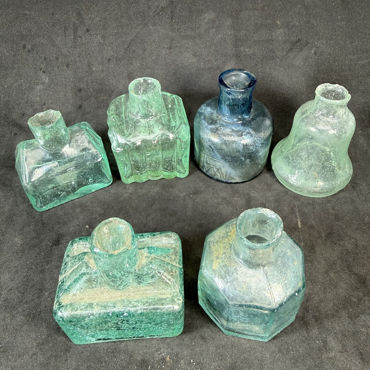 6 Small Glass Inks: Cabin shape without decoration; Boat ink, Thomas on base; Ribbed 3 sides with PC on base and pen rests; Bell shape; Octagonal; Round dome, Ice Blue.