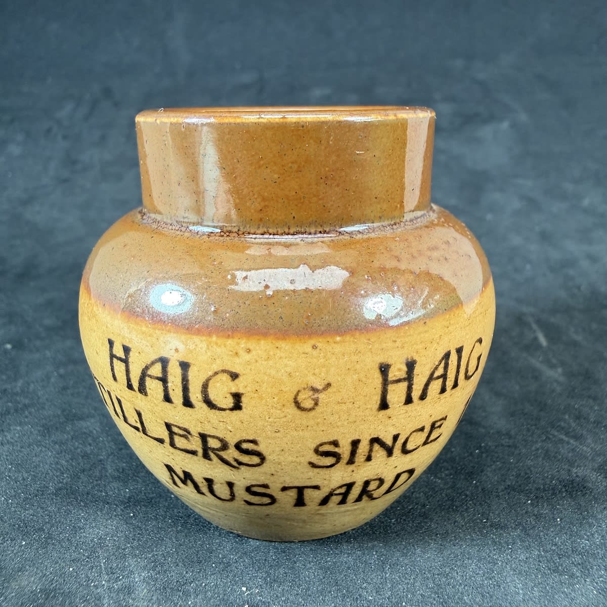 Mini sized mustard pot. Advertising Haig & Haig Distillers since 1679. Doulton Lambeth.