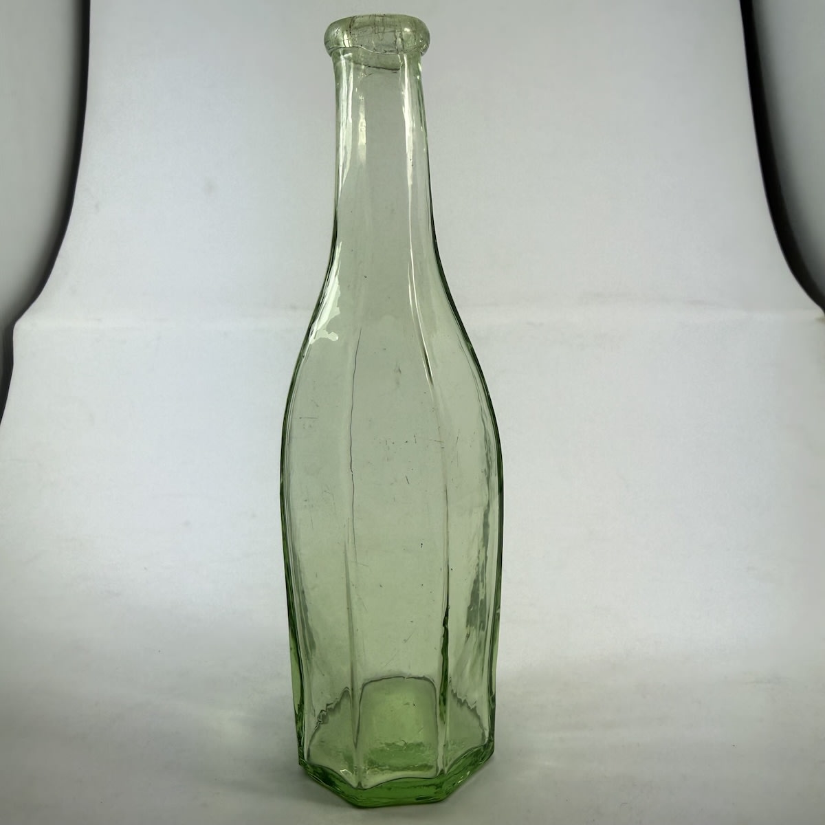 Goldfields Salad Oil. Simple Octagonal shape. Tapered neck. Small applied lip. Lime Aqua. 4 oz. 167 mm.