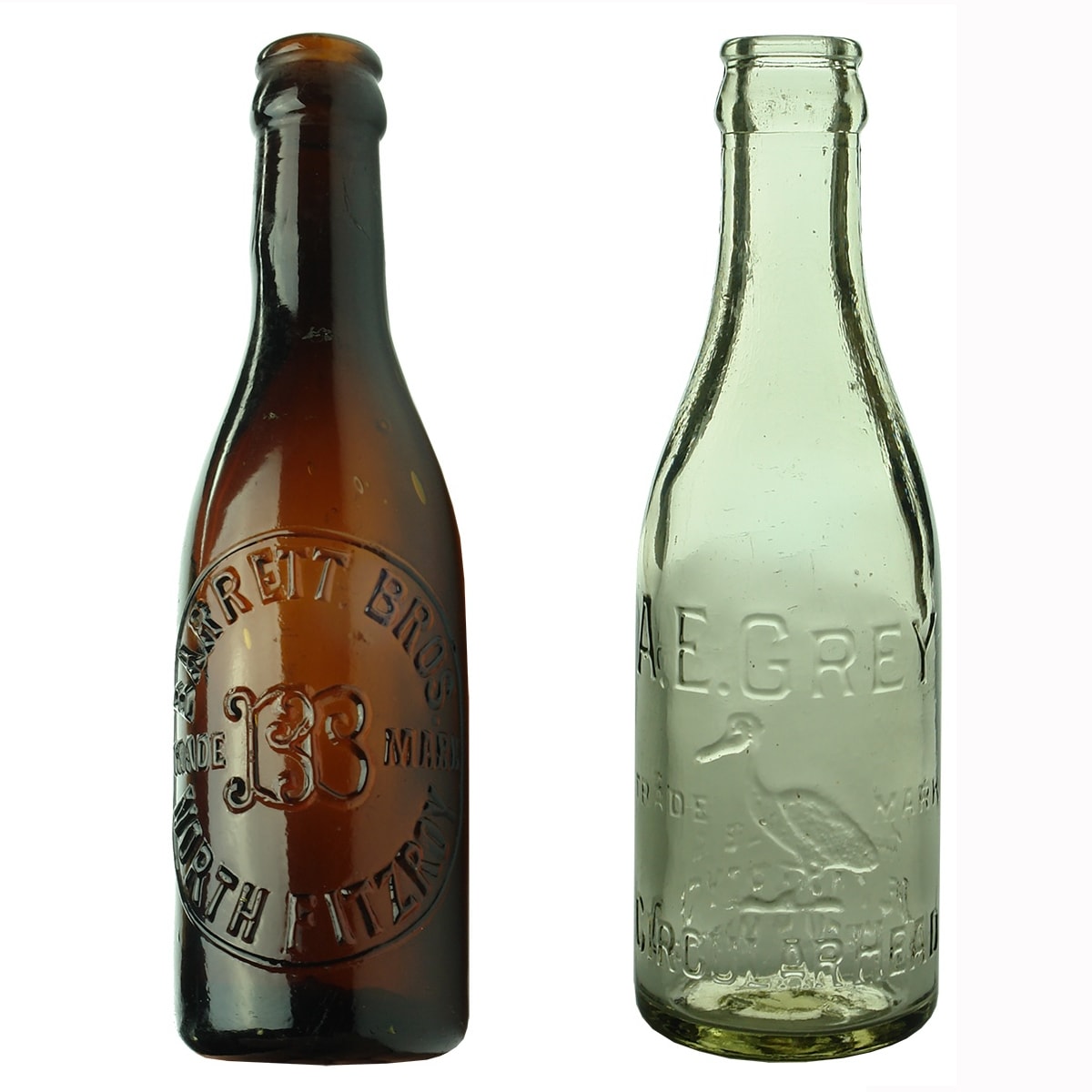2 Crown Seals: Barrett Bros., North Fitzroy, Amber Spun top; A. E. Grey, Pelican Head. Clear. 6 oz. (Victoria & Tasmania)