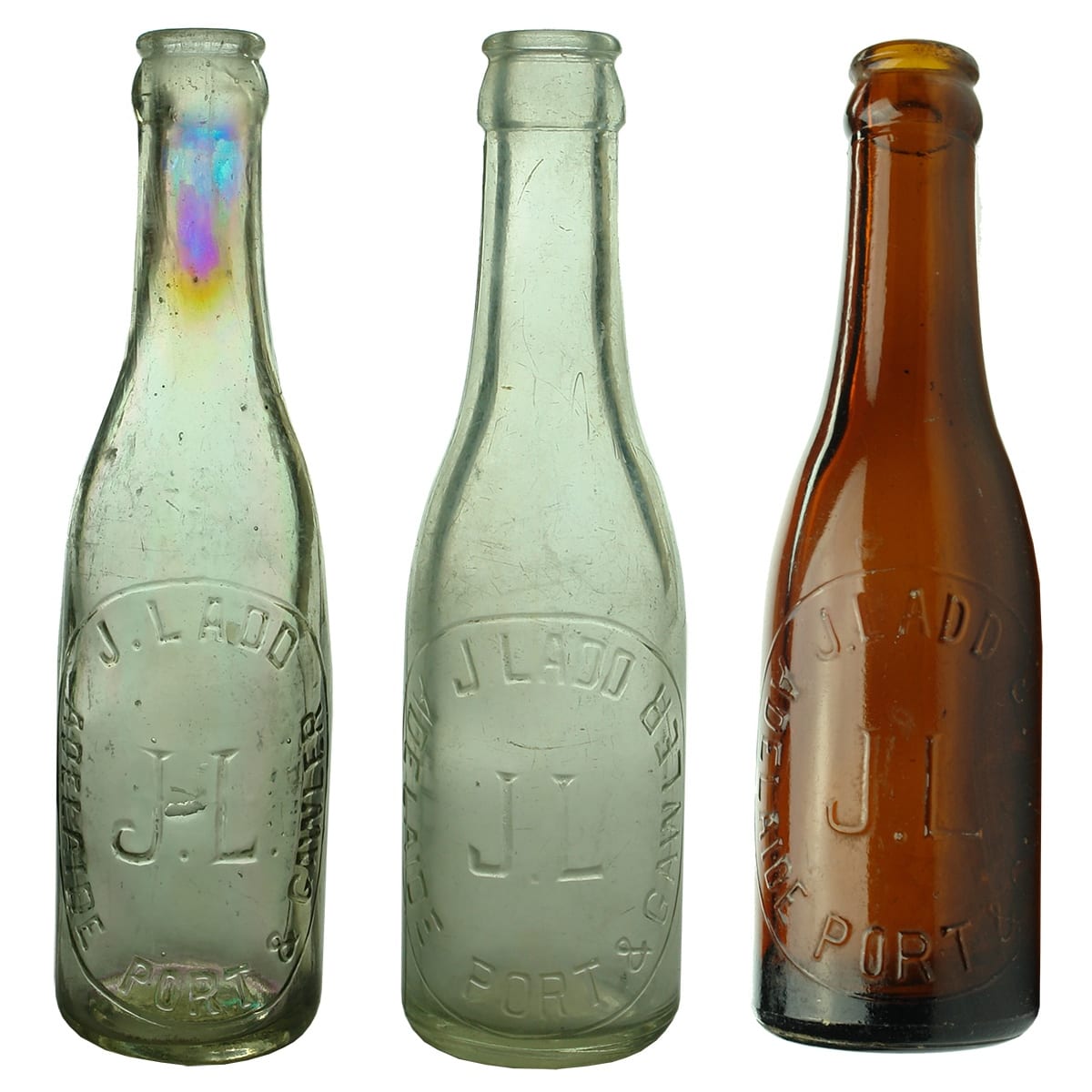 3 small J. Ladd, Adelaide Port & Gawler Crown Seals. Taller spun top and Machine made Clear & Amber. (South Australia)