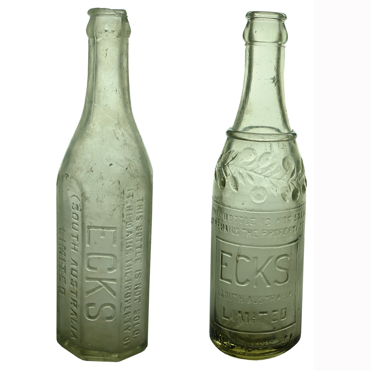 2 Crown Seals: Different varieties of Ecks (South Australia) Limited. Adelaide. Octagonal type and fancy one with fruit decoration. 10 oz. Clear. (South Australia)
