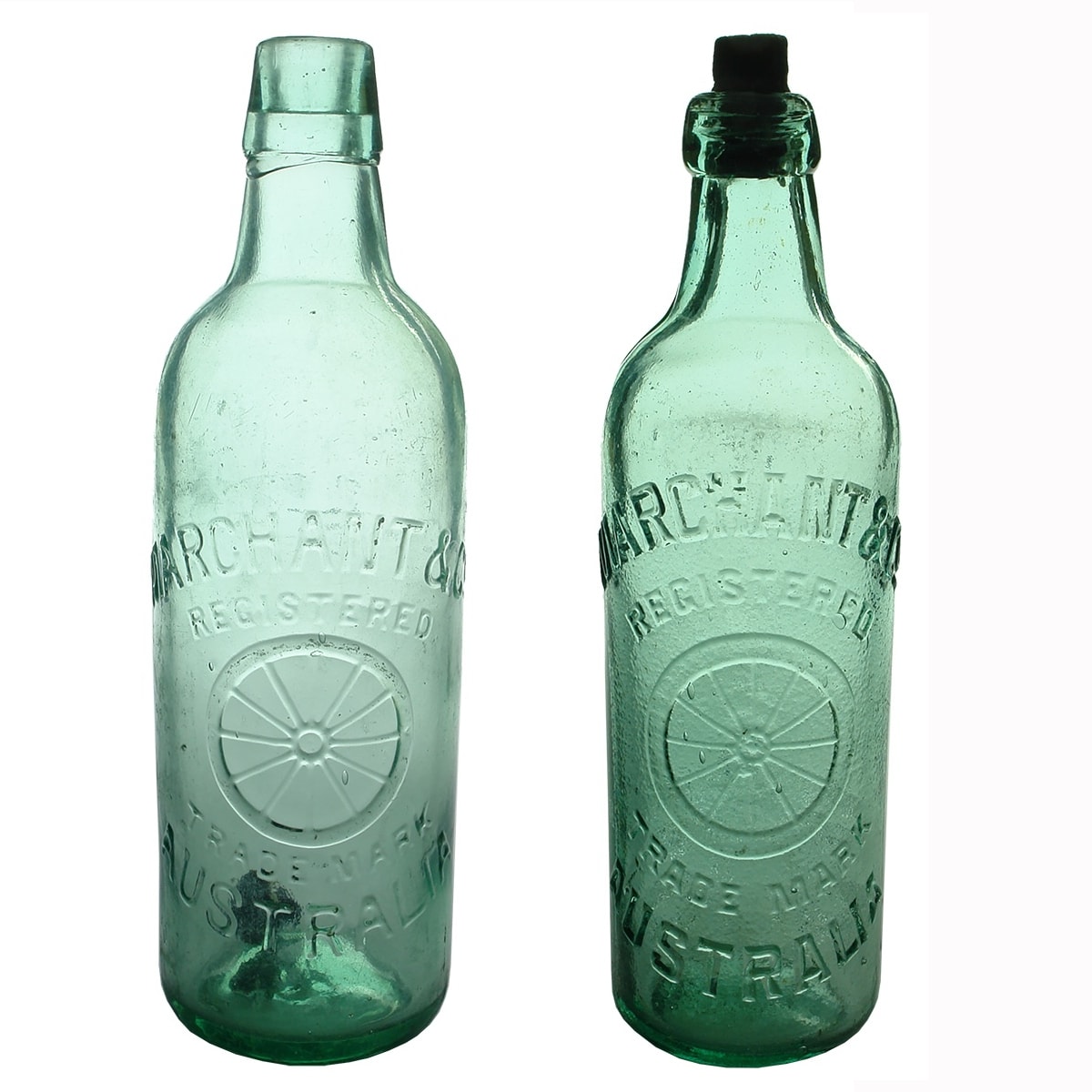 2 Marchants Bottles: 26 oz Lamont. M base mark; 26 oz Internal Thread, 4 line legal warning to lower back.