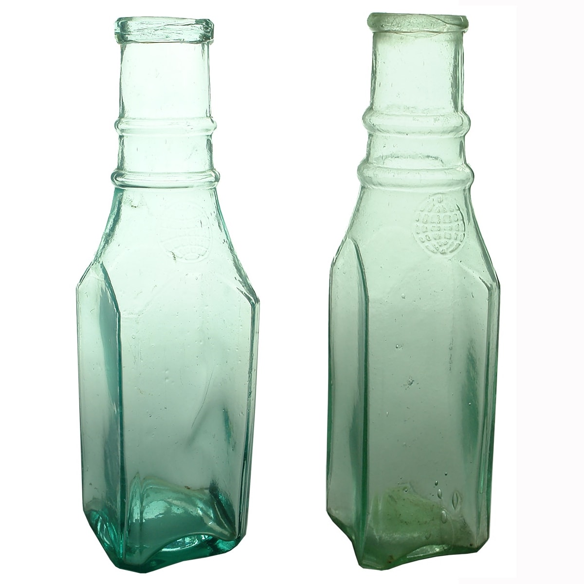 2 Goldfields Pickles. Both square, Globe on the shoulder and double ring to neck. But one is very large Quart size and one a regular pint size.