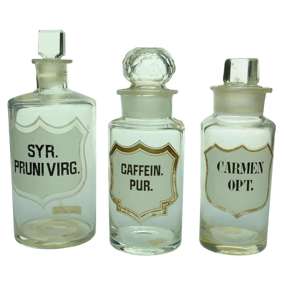 Chemist. Enamelled Label Pharmacy Jars: 1. Syr. Pruni Virg. Narrow neck. Larger size. 2. Caffein. Pur. Wide neck. Smaller size. 3. Carmen Opt. Wide neck. Smaller size. All pontilled.