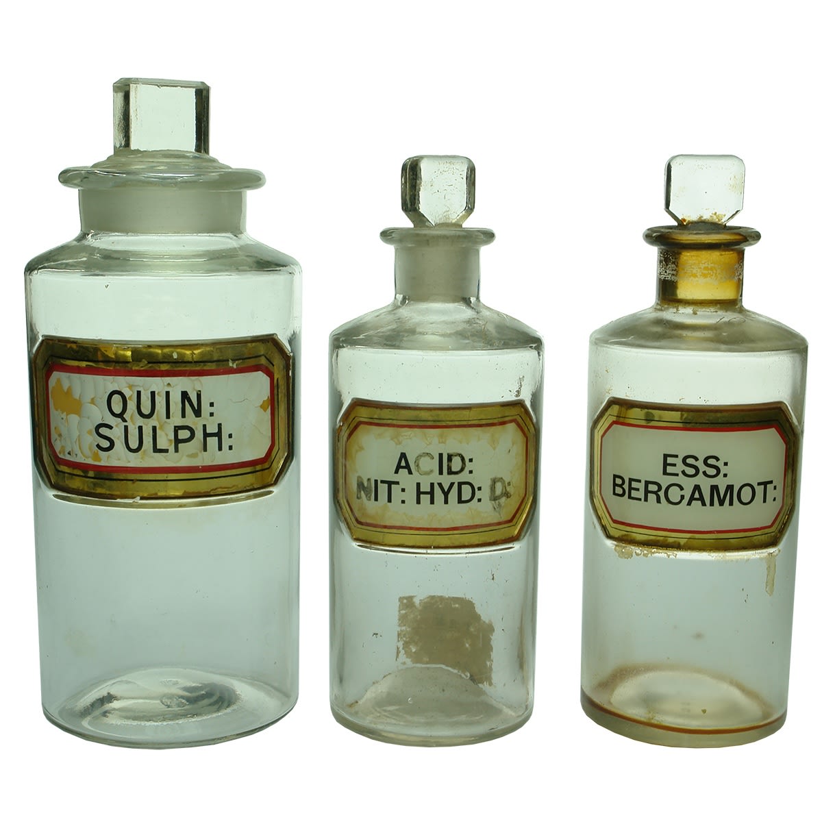 Chemist. Glass Label Pharmacy Jars: 1. Quin: Sulph: (Wide neck). Large. 2. Acid: Nit: Hyd: D: (Narrow neck). Small. 3. Ess: Bergamot: (Narrow neck). Small.
