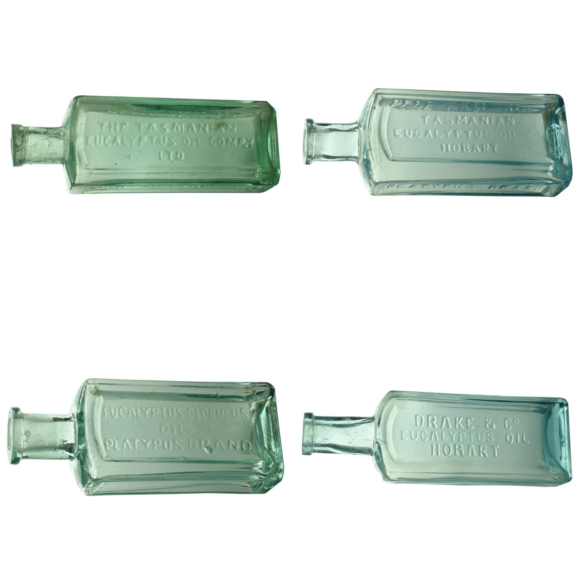 4 Tasmanian Eucalyptus Oil Bottles: 2 x different Tasmanian Eucalyptus Oil Co Ltd (132 & 121 mm); Small Eucalyptus Globulus (100 mm), Platypus Brand; Drake & Co., Hobart (144 mm). (Tasmania)