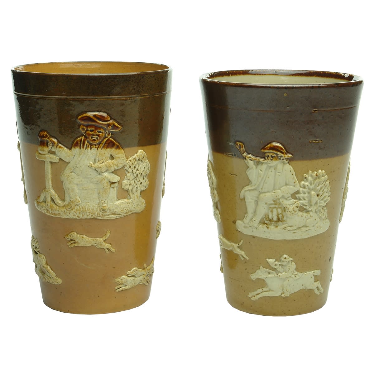 2 Royal Doulton Harvestware Beakers. Various scenes of men drinking and/or smoking at tables. Dogs, Stag, Huntsmen. Royal Doulton stamps to bases.