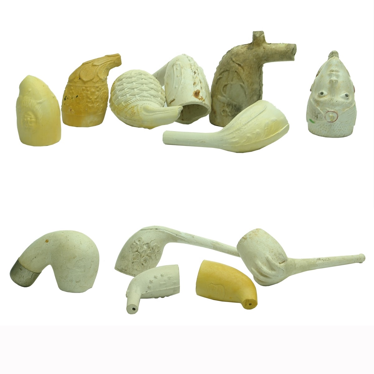 12 Clay Pipes / Bowls: 2 Complete with Claw holding bowl and Thistle, Shamrocks etc; Various faces; Basket Weave; Ship & Anchor; Lions; Metal Capped; TD (Travis Dunn?) surrounded by Stars