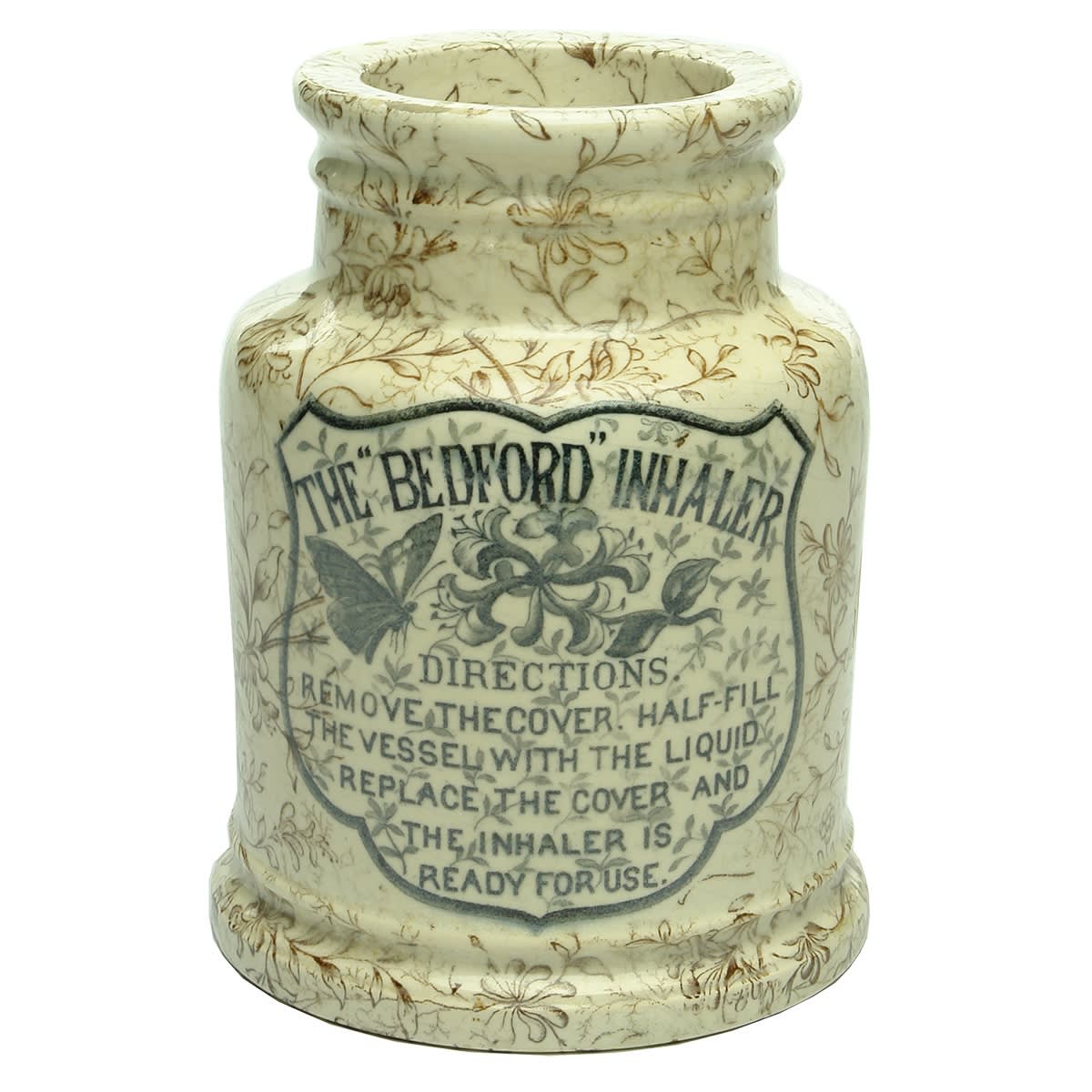 Inhaler. The Bedford Inhaler. Butterfly & Flowers in black print and brown floral pattern all over.