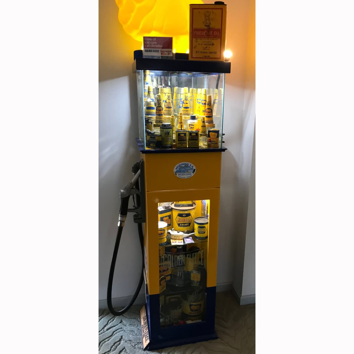 Custom Built Golden Fleece Display Cabinet. Shape of A Golden Fleece Bowser. Glass top. Lower cabinet section. Real pump handle attaches to the side. (Not for post. Buyer to make arrangements for a courier or pickup is welcome).
