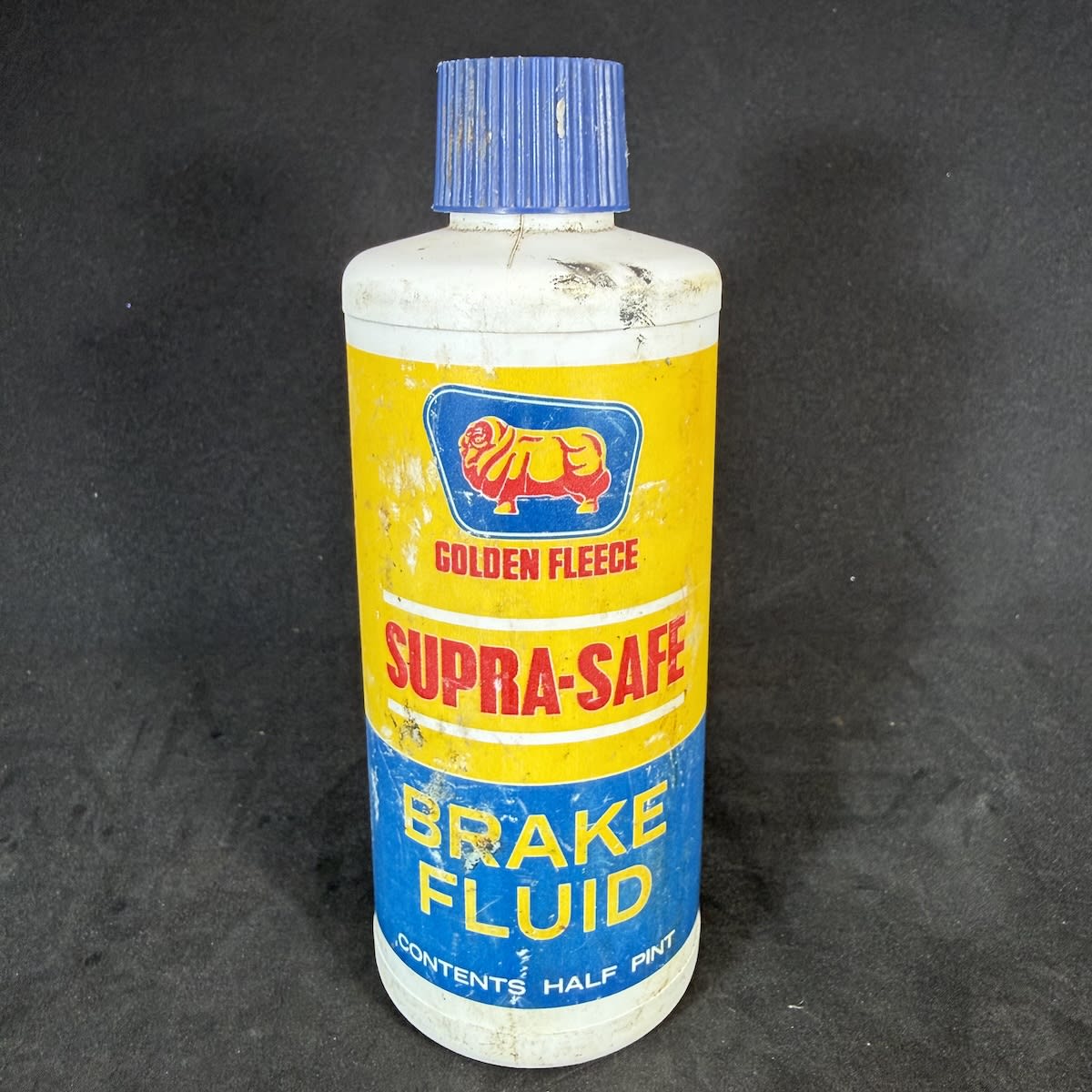 Garaganelia. Golden Fleece Supra-Safe Brake Fulid Half Pint Plastic bottle. Golden Fleece Petroleum.