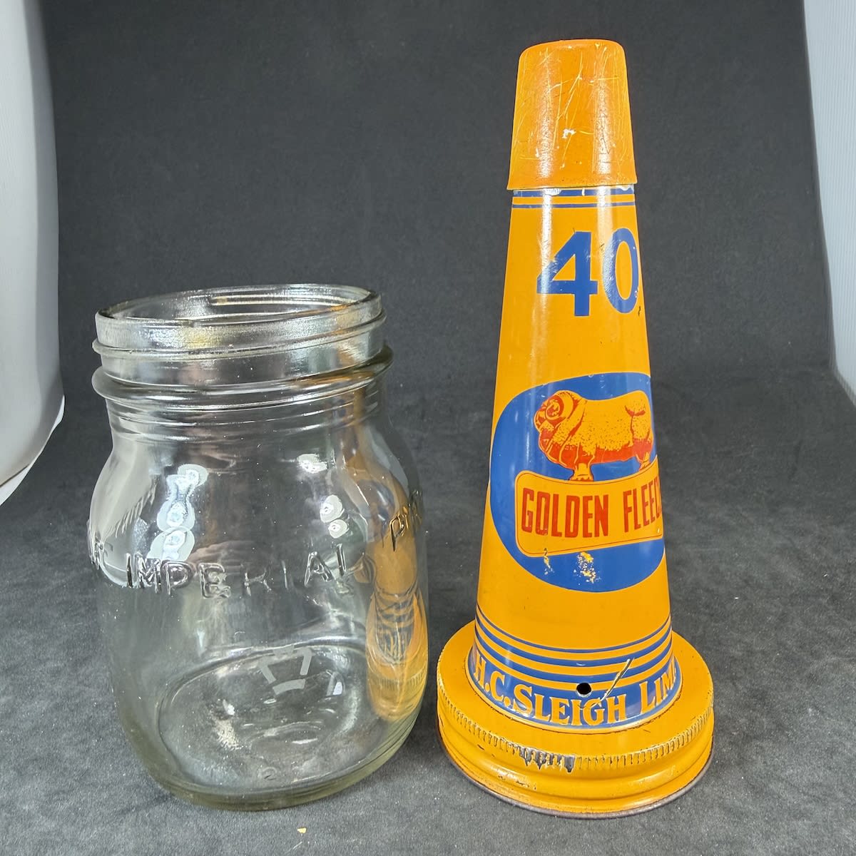 Oil Bottle & Tin Top. Golden Fleece, H. C. Sleigh Limited tin top. Generic Half Imperial Pint oil bottle. Etched crown.