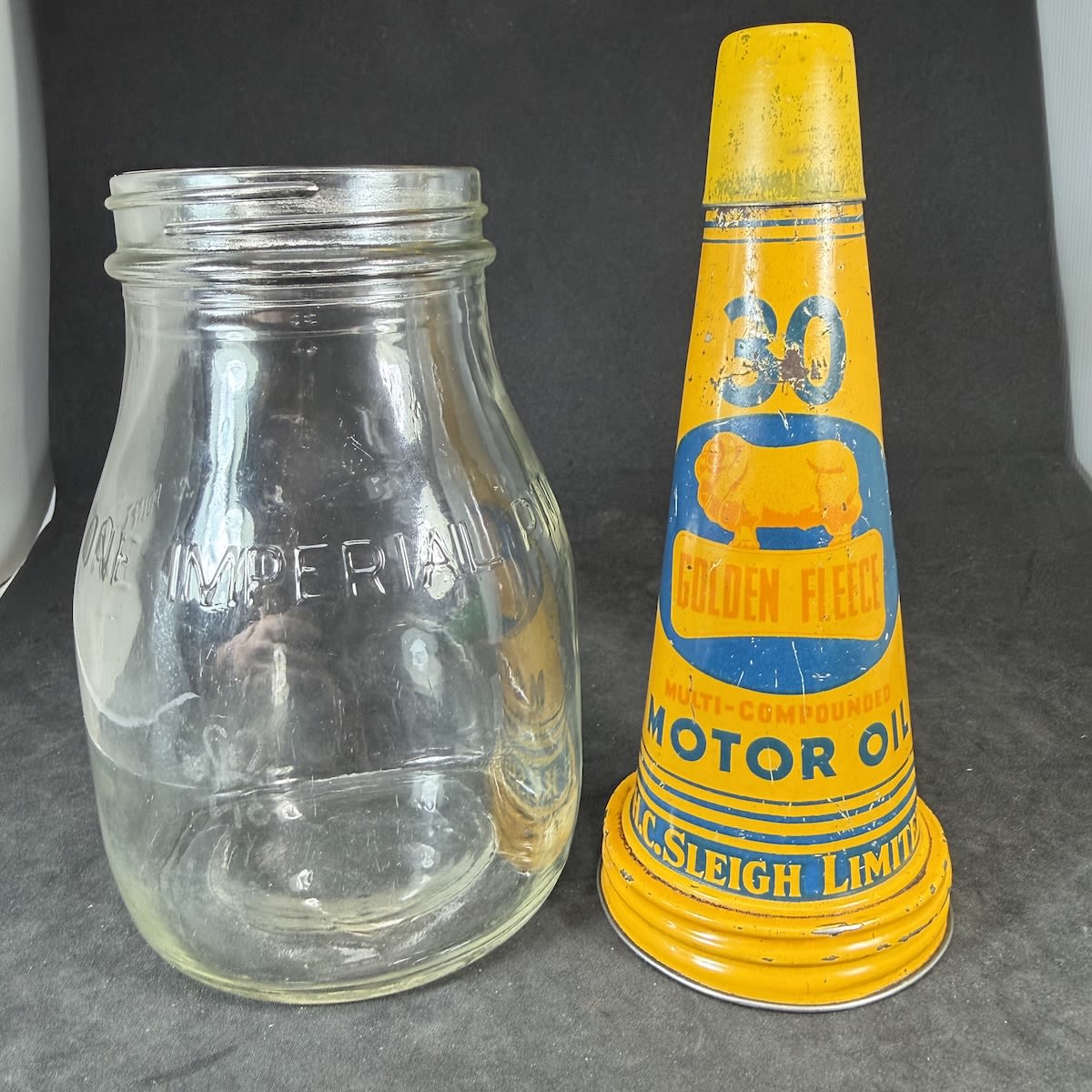 Oil Bottle & Tin Top. Golden Fleece, H. C. Sleigh Limited tin top. 30 Multi Compounded Motor Oil. One Imperial Pint oil bottle. Etched crown.