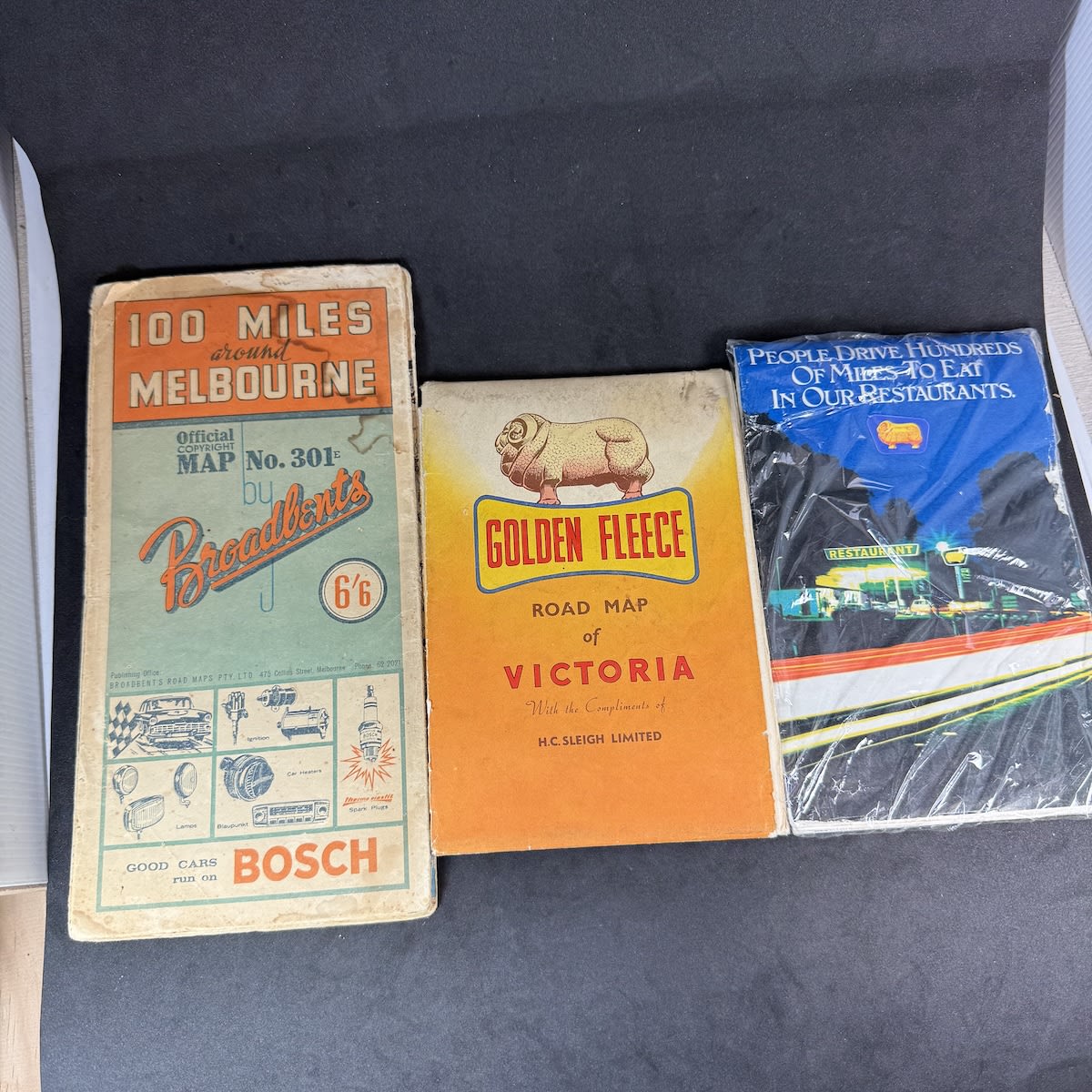 3 Road Maps that all feature some Golden Fleece Advertising.